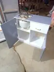 Gray and White Gas Cabinet - 1