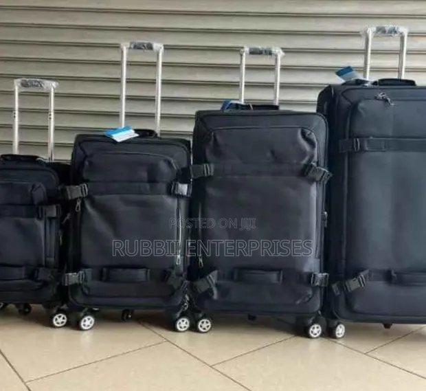 4-Piece Black Softside Rolling Upright Suitcase Set - 1