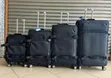 4-Piece Black Softside Rolling Upright Suitcase Set - 2