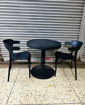 Round Dining Table with 2 Minimalist Curved-Back Chairs