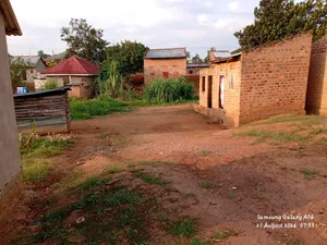 Plot with Unfinished House for Sale in Nalongo, Luwero