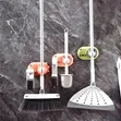 Wall-Mounted Mop and Broom Holder - Pink Dinosaur - 1