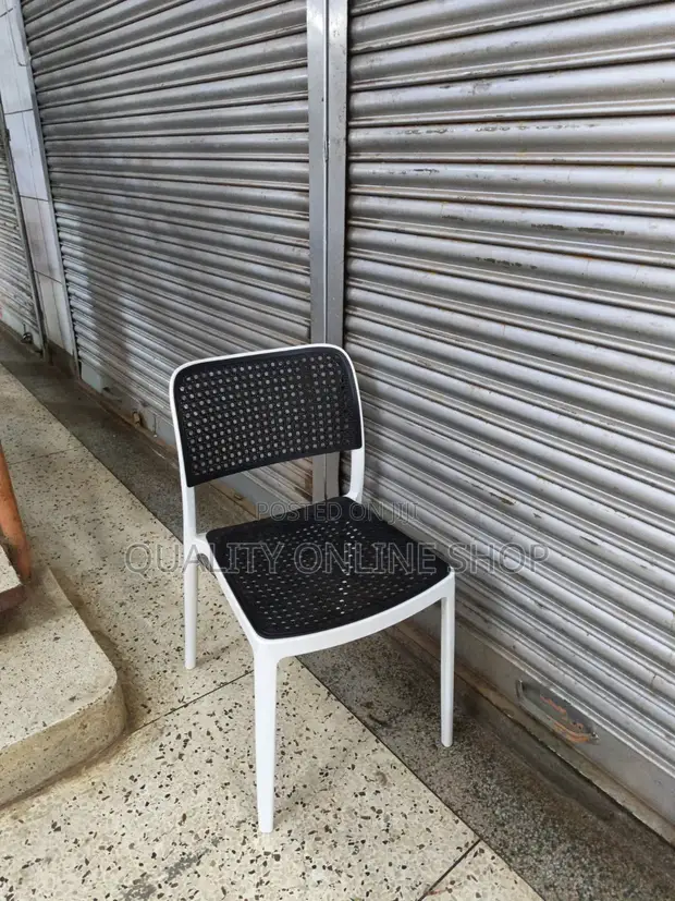 Stackable White and Black Plastic Chairs - 1
