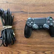 Sony PS4 Pro 1TB with 32 Games and 2 Controllers - 1