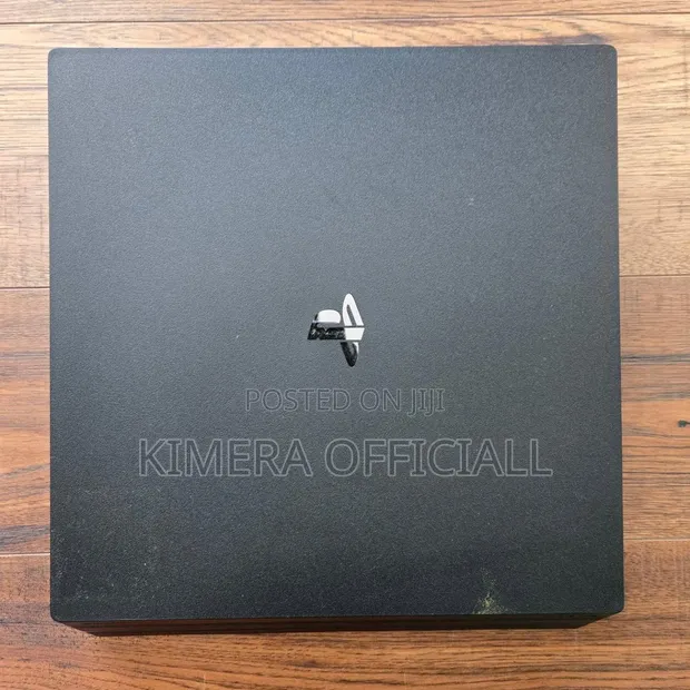 Sony PlayStation 4 Pro 1TB, 32 Games, 2 Controllers - 1