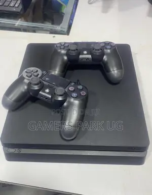 PS4 Slim Console with 2 Controllers & 8 Games