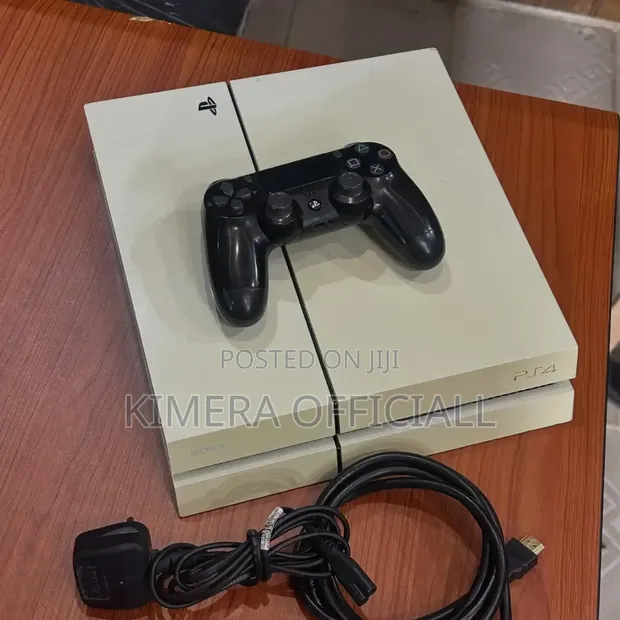 Sony PlayStation 4 Standard 500GB with 12 Games & 2 Controllers - 1