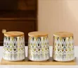 Elegant Ceramic Canister Set with Gold Geometric Pattern and Bamboo Lids - 1