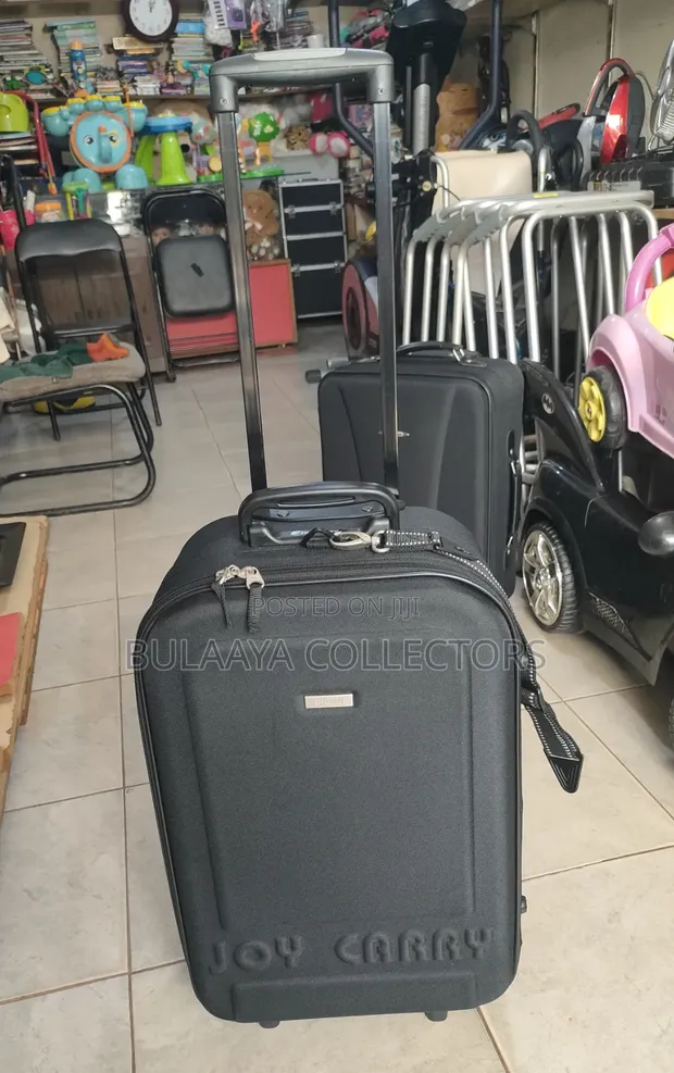 Joy Carry Black Fabric Medium Rolling Suitcase - 1
