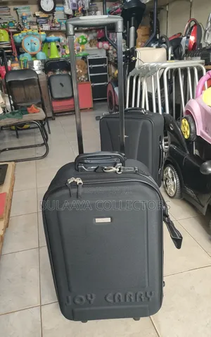 Joy Carry Black Fabric Medium Rolling Suitcase