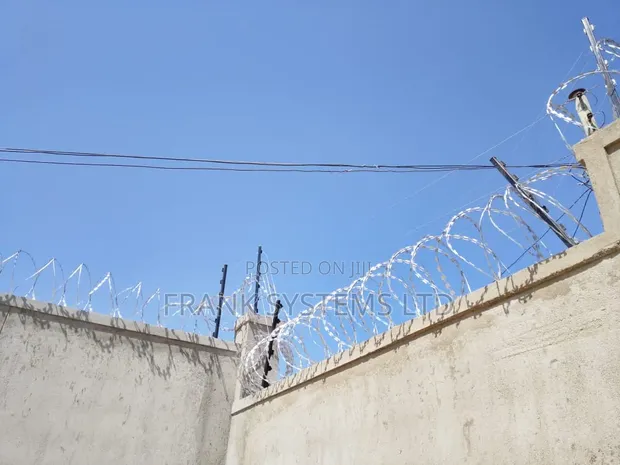Electric Fence Installation with Razor Wire - 1