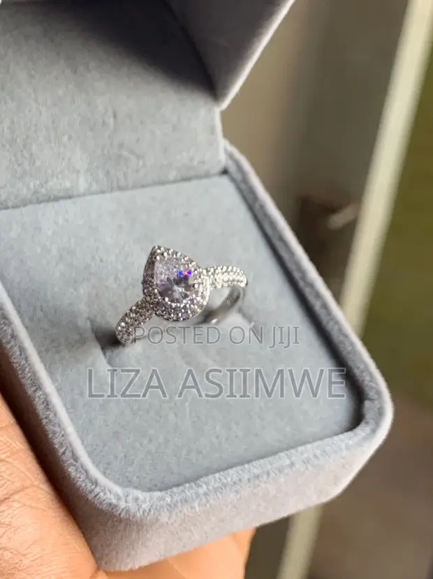 Elegant Engagement Ring with Pear-Shaped Center Stone Frame - 1