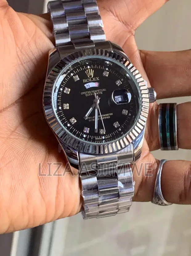 Silver Rolex Watch with Black Dial and Crystal Markers - 1