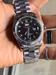 Silver Rolex Watch with Black Dial and Crystal Markers - 1