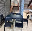 1 Black Plastic Table + 6 Black Slatted Armless Chairs - 2