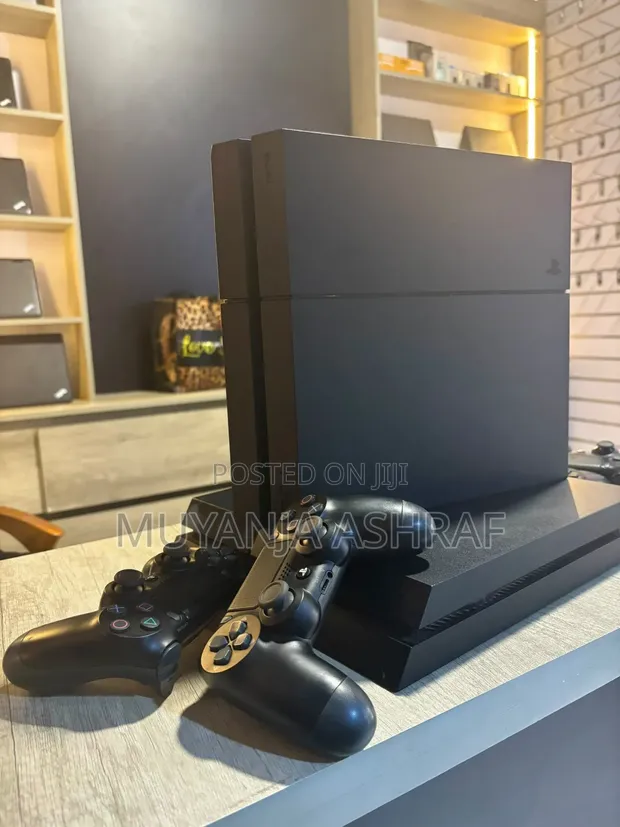 PlayStation 4 Standard with 7 Games and 2 Controllers - 1