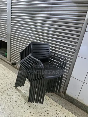Brand New Stackable Plastic Chairs with Armrests