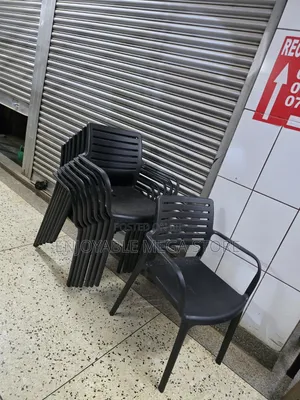Brand New Stackable Plastic Chairs with Armrests