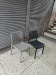Modern Stackable Black Plastic Chairs - 2