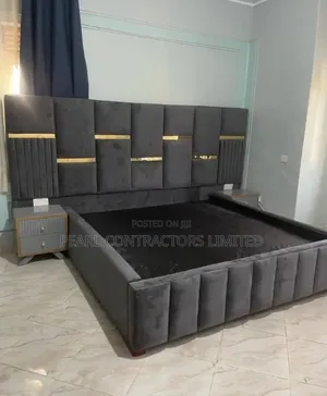 Upholstered Bed with Gold Strips and Side Tables