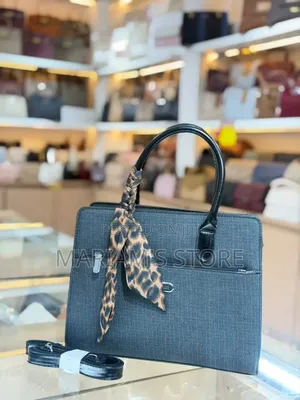 Structured Beige Handbag with Leopard Scarf