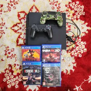Used Sony PlayStation 4 Standard Console with 12 Games and 2 Controllers