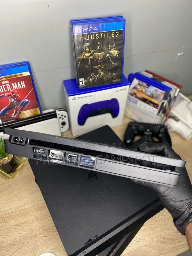 Sony PlayStation 4 Slim with 13 Games and 2 Controllers - 1
