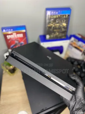 PS4 Slim Console with 13 Games and 2 Controllers