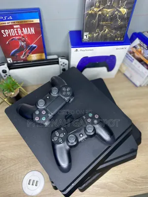 PS4 Slim Console with 13 Games & 2 Controllers