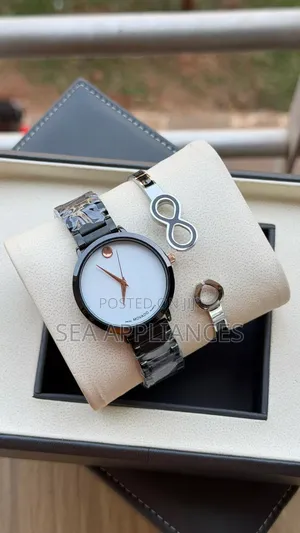 Movado Women's Watch - Black Stripes, White Face