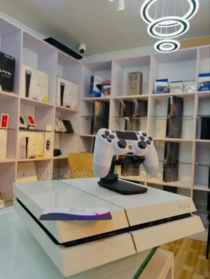 PS4 Fat Console with 13 Games & 2 Controllers