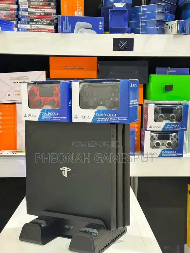 UK-Used PS4 Pro with 32 Games & 2 Controllers - 1