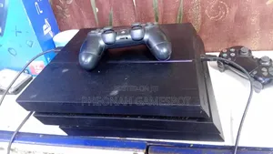 Chipped PS4 Fat Console with 12 Games & 2 Controllers
