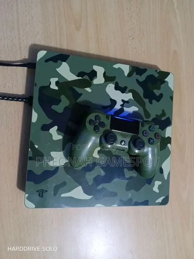 PS4 Slim Console with 2 Controllers and 12 Games - 1