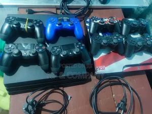 Playstation 4 Pro with 4 Controllers and 15 Games