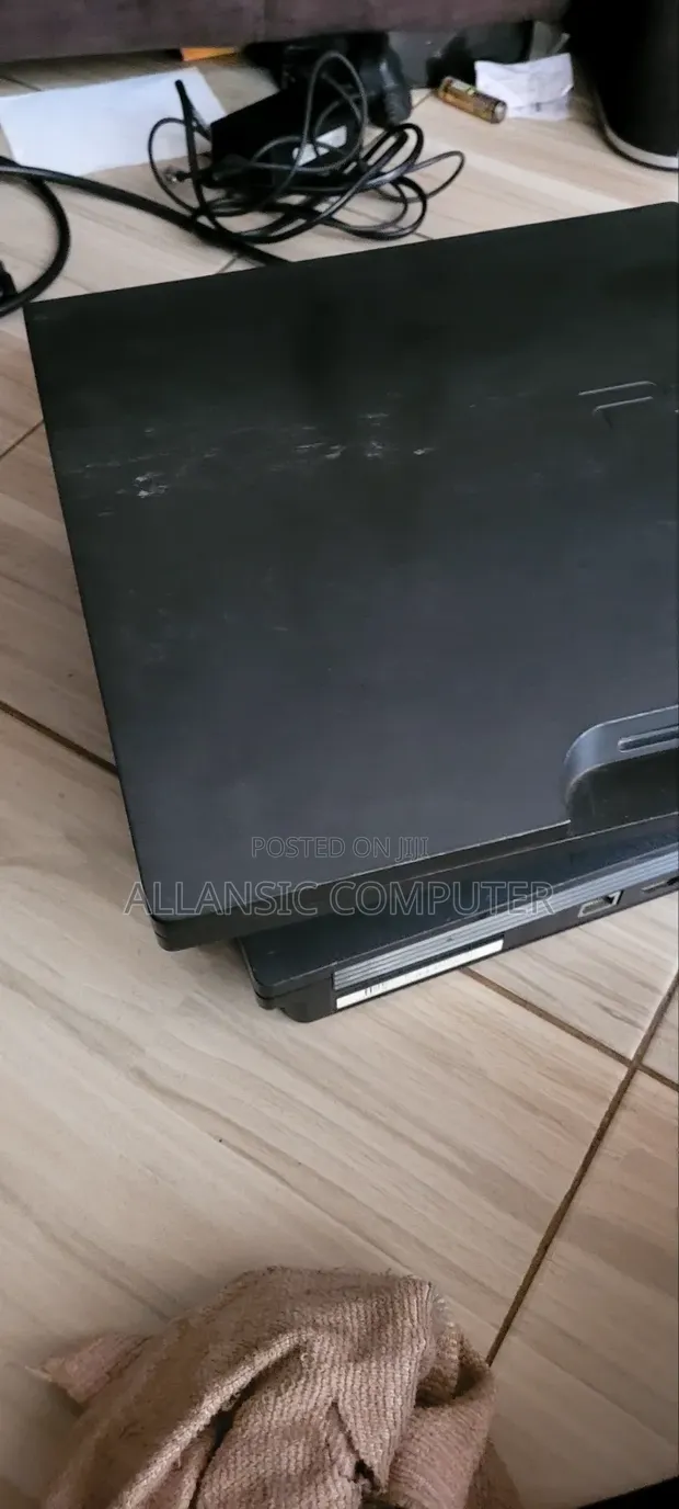 PS3 Slim Console with 2 Controllers & 20 Games - 1