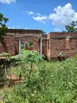 0.56 Acre Titled Land with Unfinished 4-Bedroom House in Zirobwe - 1